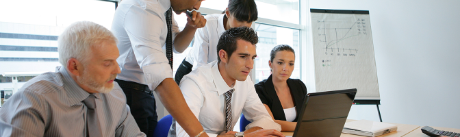 Business people in a meeting with a laptop computer